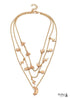 Conjunto de collares bohemios dorados con fénix lunar